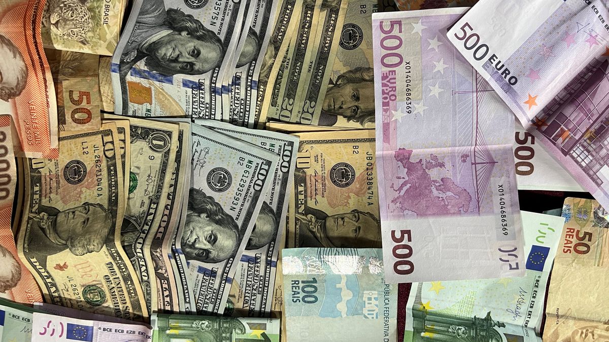 Banknotes from many countries — US dollars, euros and more — piled together on a desk, the multi-currency reach a Hong Kong company opens to a mainland founder