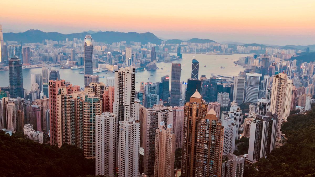 Kowloon skyline at dusk with skyscrapers and harbour — the financial centre a Hong Kong company calls home