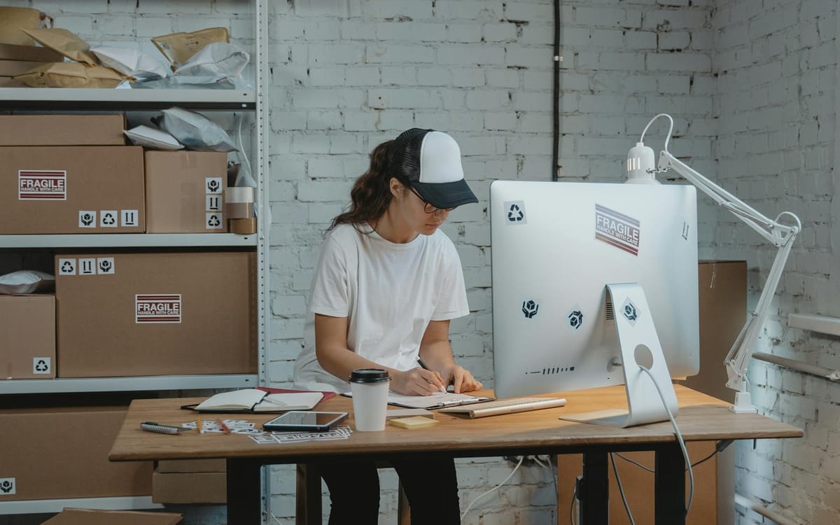 Online seller managing inventory and preparing e-commerce shipments